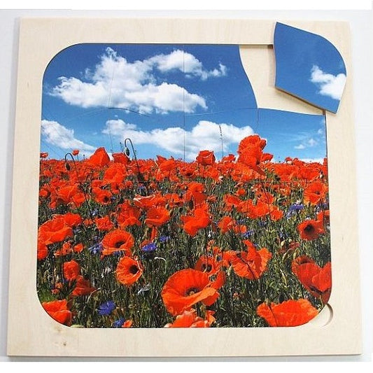 Puzzel Klaproos – Houten 16-delige puzzel met klaproosmotief, ideaal voor geheugenstimulatie bij senioren.